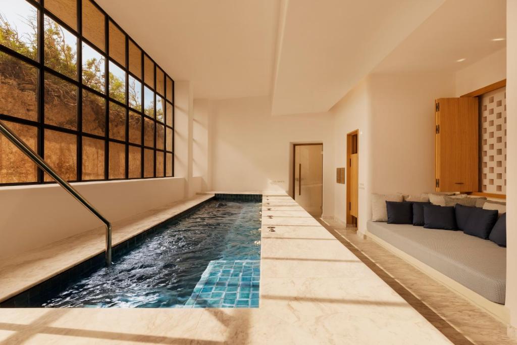 an indoor pool in the middle of a house at Six Senses Ibiza in Portinatx