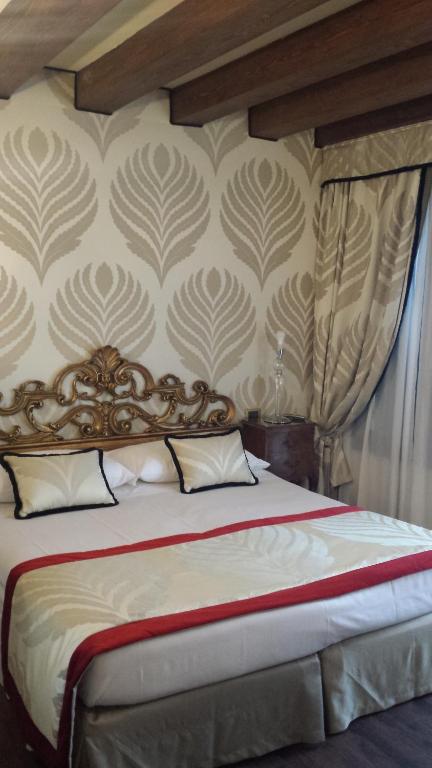 Postel nebo postele na pokoji v ubytování Hotel Amadeus