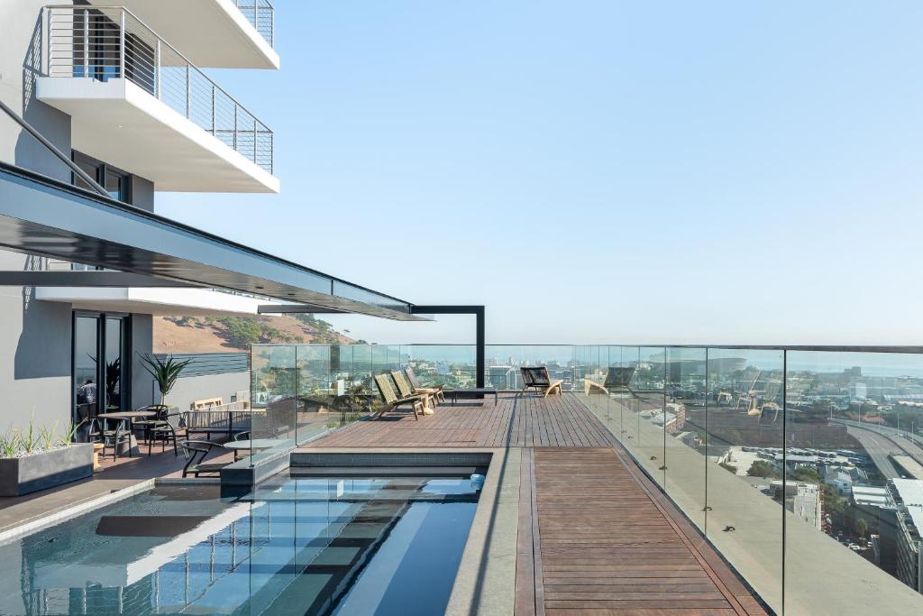a swimming pool on the roof of a building at 16 on Bree Luxury Apartments in Cape Town