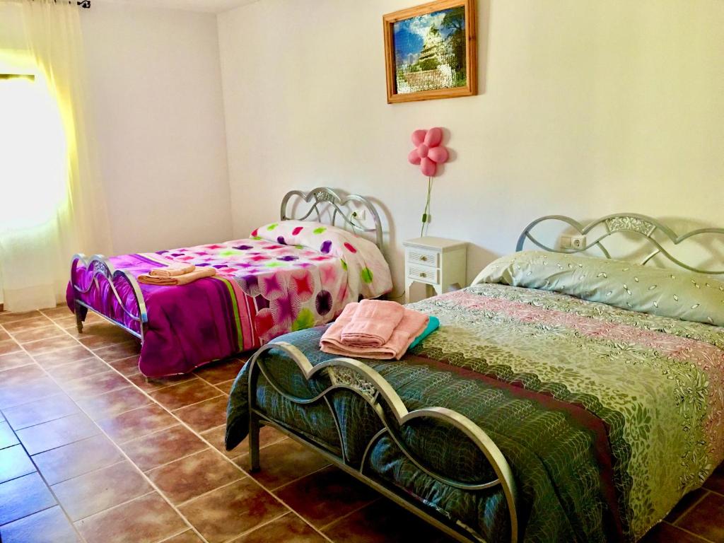 Postel nebo postele na pokoji v ubytování Casa Rural Hoyo de Los Pájaros