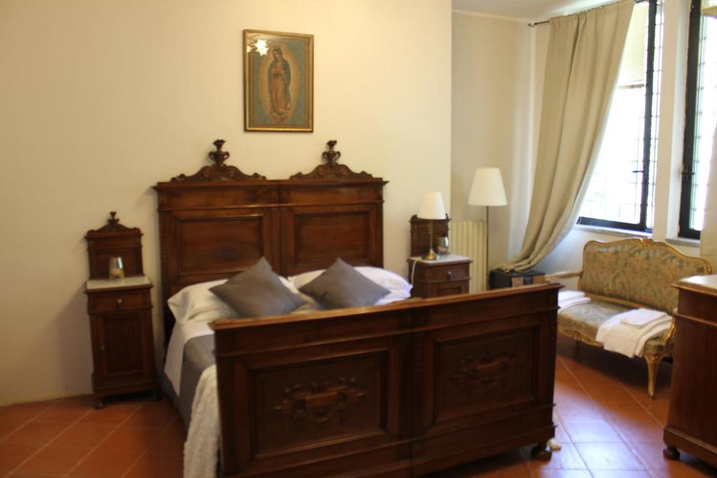 Postel nebo postele na pokoji v ubytování ABBAZIA SS. QUIRICO E GIULITTA