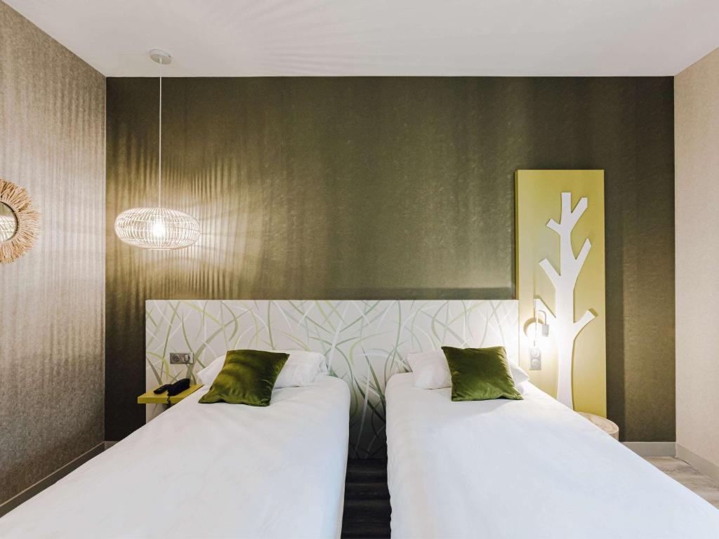 Postel nebo postele na pokoji v ubytování ibis Styles Contres-Cheverny