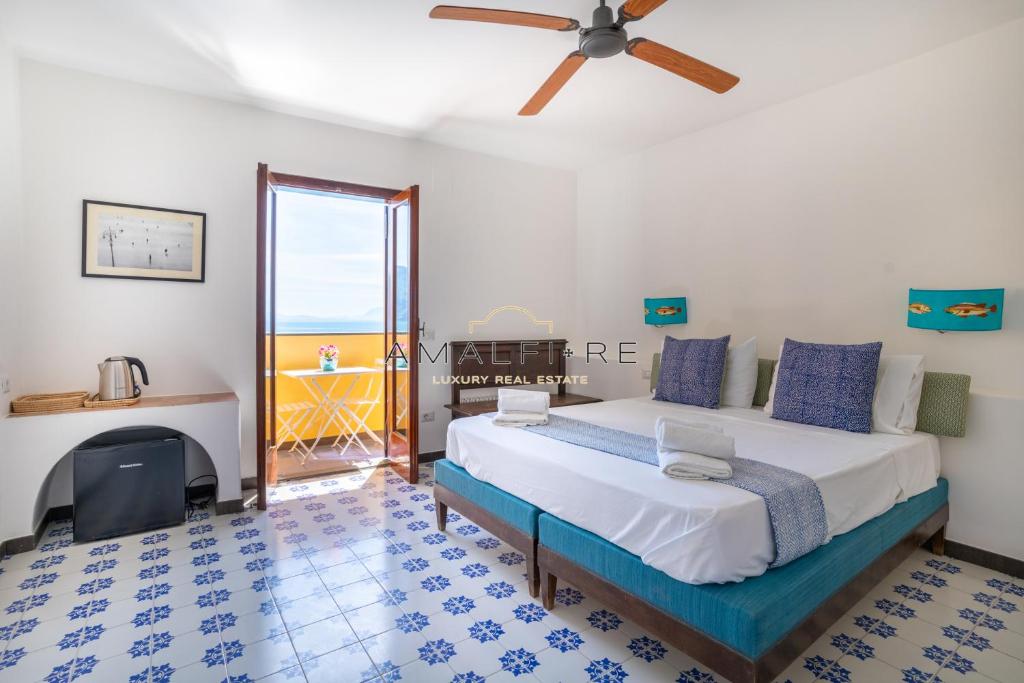 Posteľ alebo postele v izbe v ubytovaní Poseidone Suite , a due passi dalla spiaggia