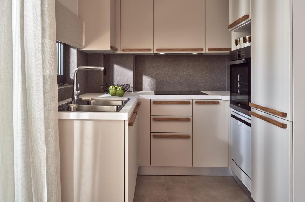 A kitchen or kitchenette at Uparati villa - Hilltop Sea View Retreat
