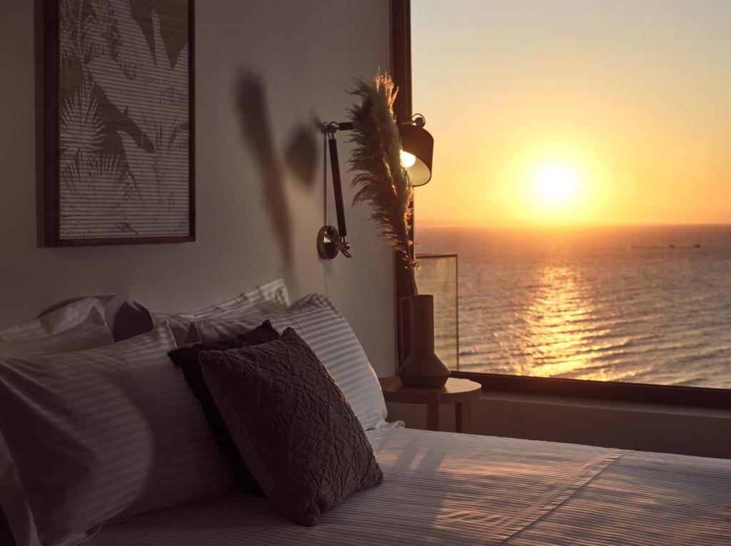 A bed or beds in a room at Uparati villa - Hilltop Sea View Retreat