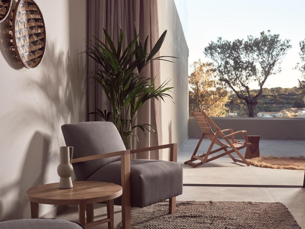 A seating area at Uparati villa - Hilltop Sea View Retreat