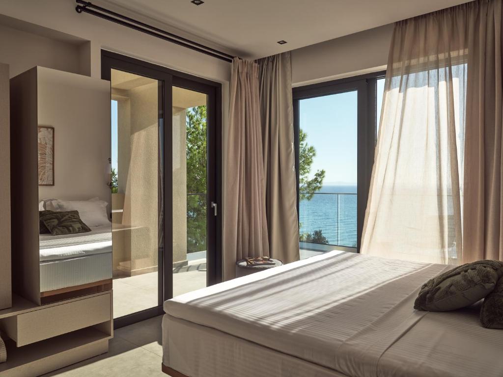 A bed or beds in a room at Uparati villa - Hilltop Sea View Retreat
