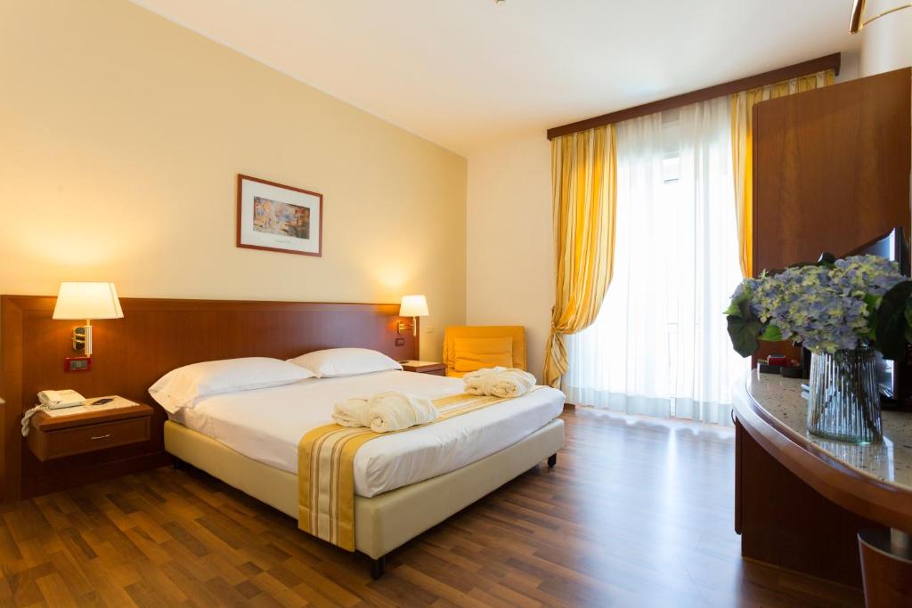 Postel nebo postele na pokoji v ubytování Hotel Europa