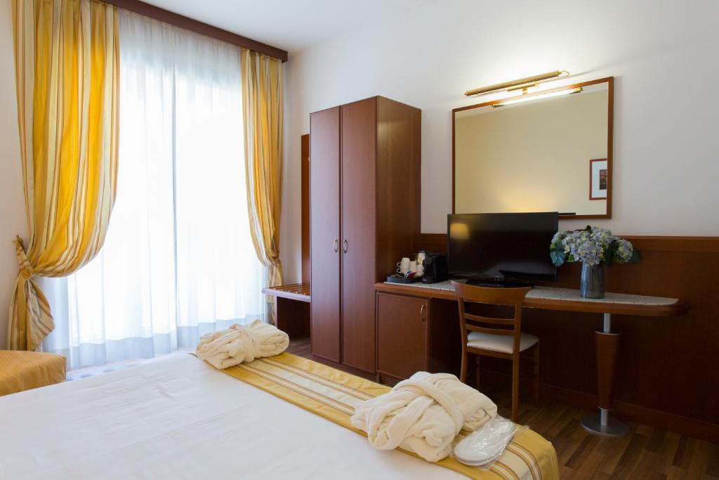 Postel nebo postele na pokoji v ubytování Hotel Europa