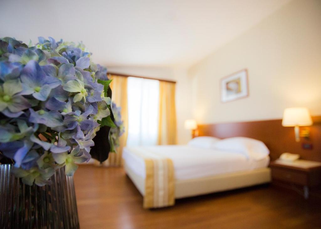 Postel nebo postele na pokoji v ubytování Hotel Europa