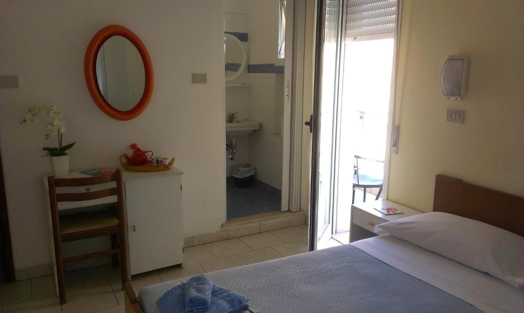 Postel nebo postele na pokoji v ubytování Albergo Maria Gabriella
