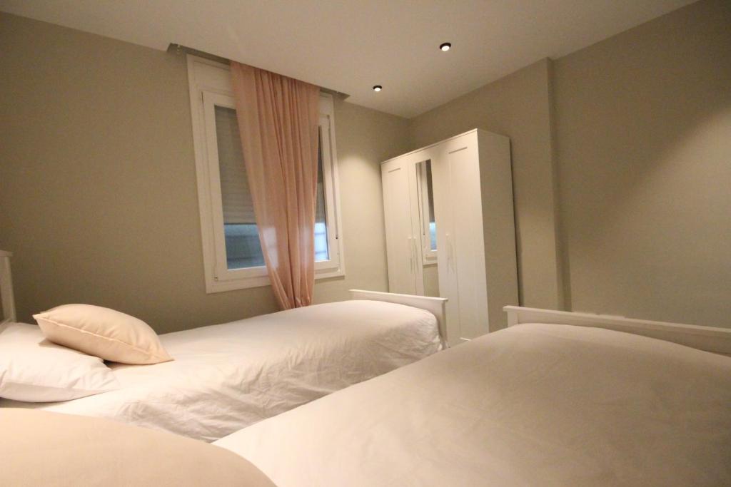 A bed or beds in a room at Apartment Azahara Sunrises, Los Cristianos