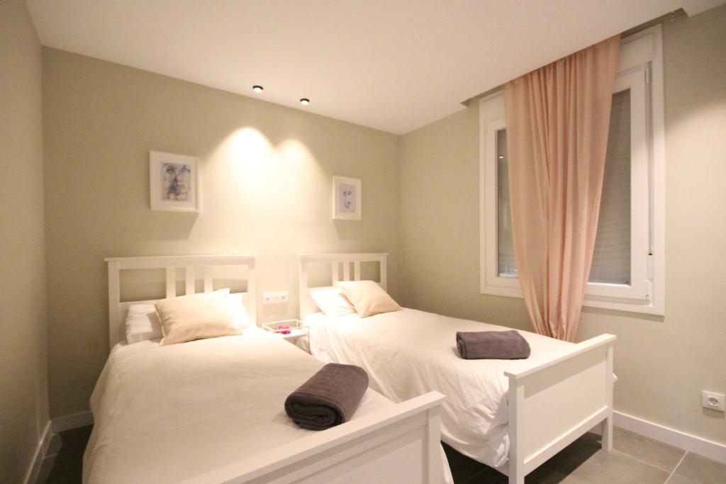 A bed or beds in a room at Apartment Azahara Sunrises, Los Cristianos