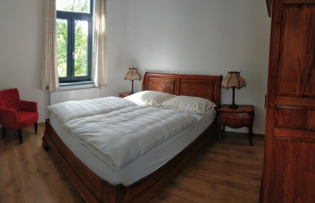 Postel nebo postele na pokoji v ubytování Apartmány Klášterní 84