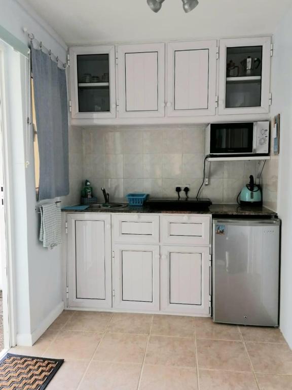 Kuchyň nebo kuchyňský kout v ubytování Marisa Residences