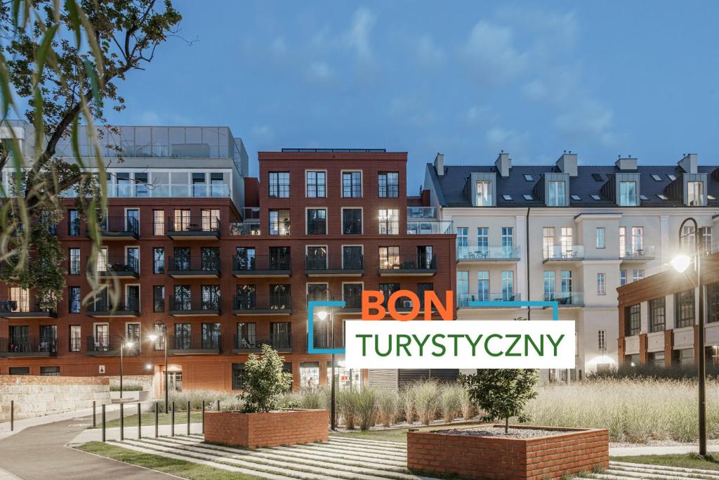 a rendering of a building with a sign in front of it at Absyntapart - Bulwar Staromiejski in Wrocław
