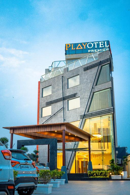 a building with a sign on the top of it at Playotel Premier Guna in Guna