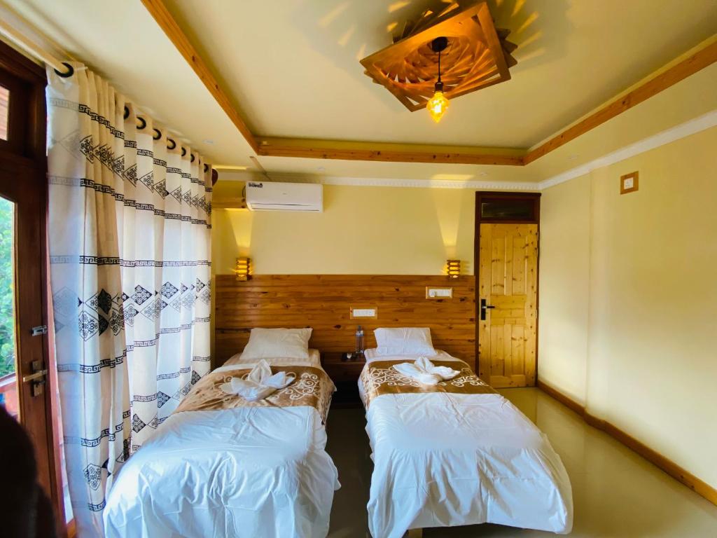Postel nebo postele na pokoji v ubytování Mariana Maldives