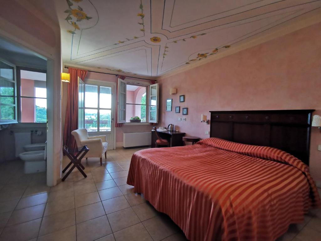 Postel nebo postele na pokoji v ubytování Il Melograno Country House