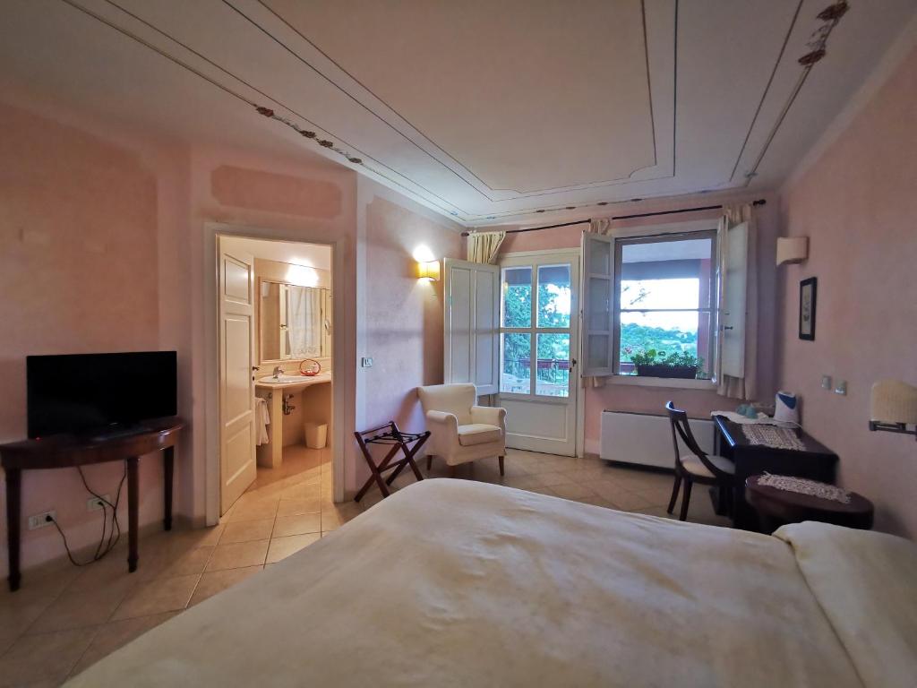 TV a/nebo společenská místnost v ubytování Il Melograno Country House