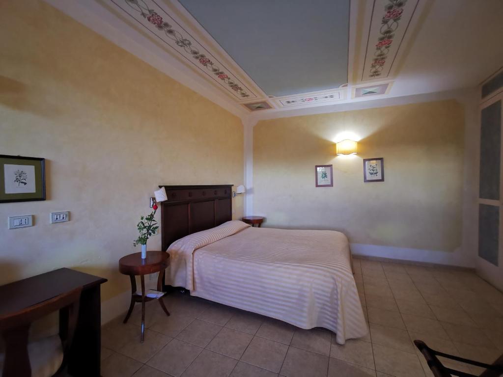 Postel nebo postele na pokoji v ubytování Il Melograno Country House