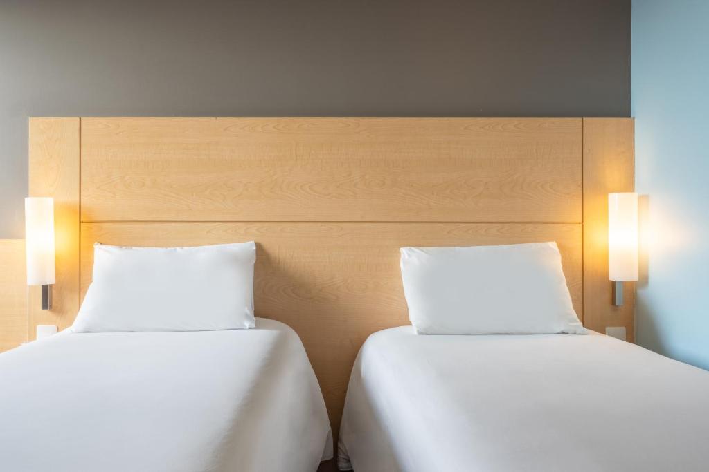 Cama o camas de una habitación en Ibis Merida