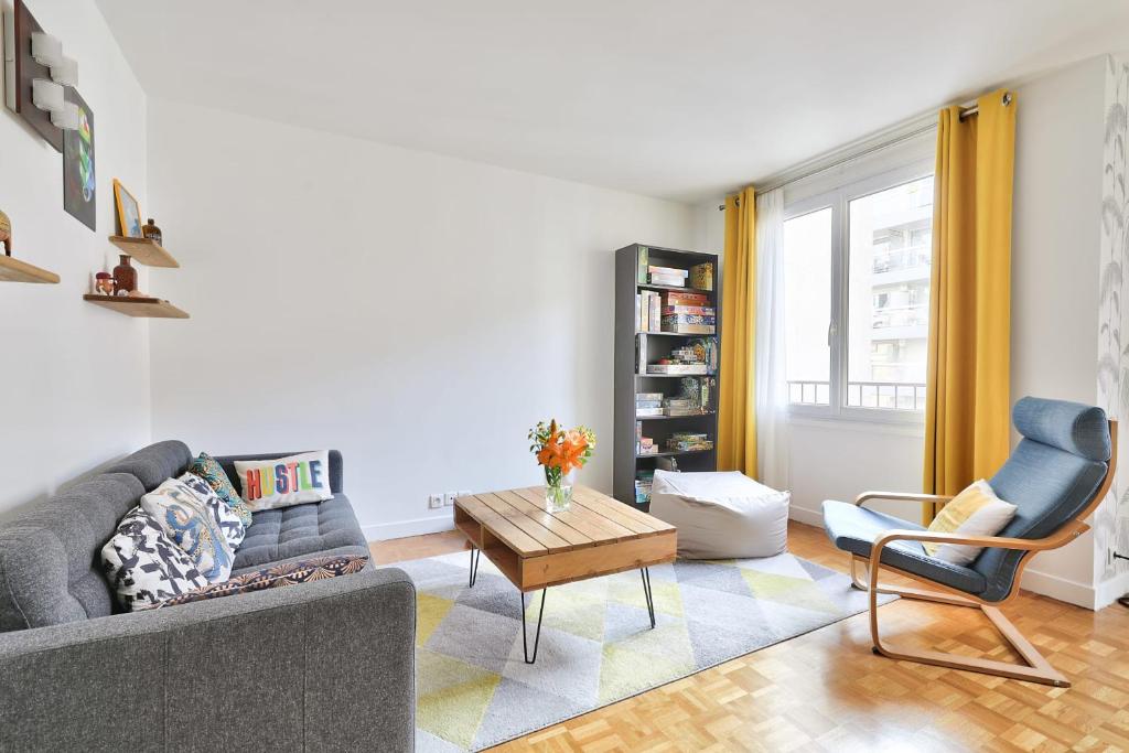 a living room with a couch and a coffee table at GuestReady - Modern and Cosy apt in the 15th in Paris