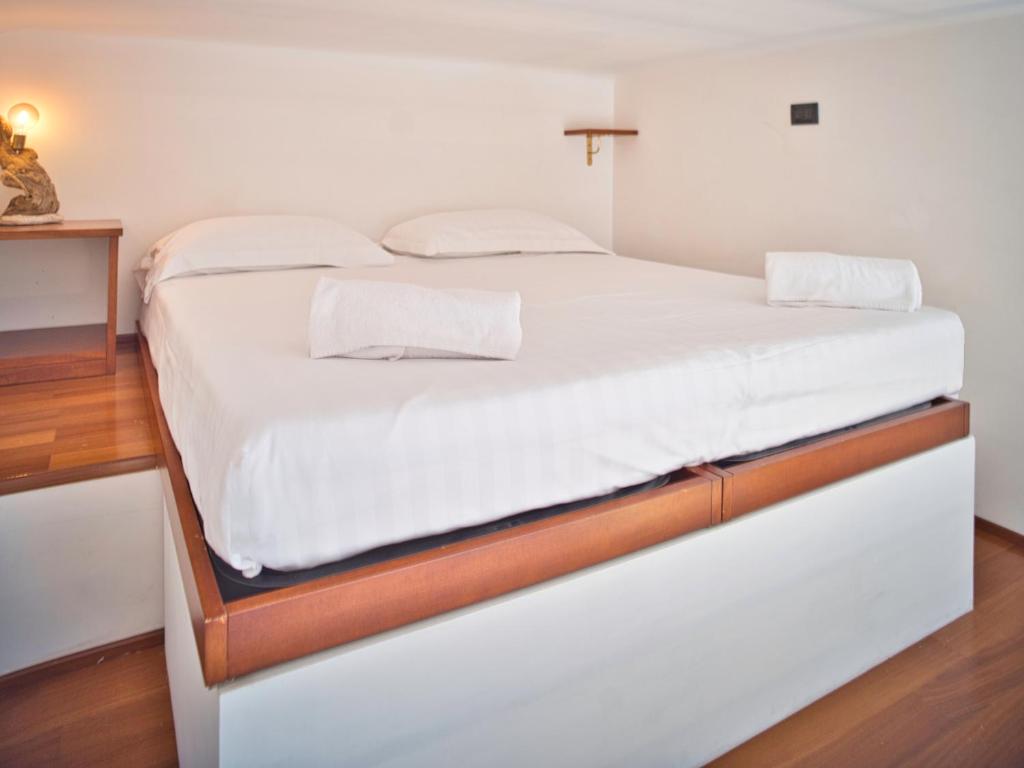 Posteľ alebo postele v izbe v ubytovaní Medusa Apartment - Monolocale Centro