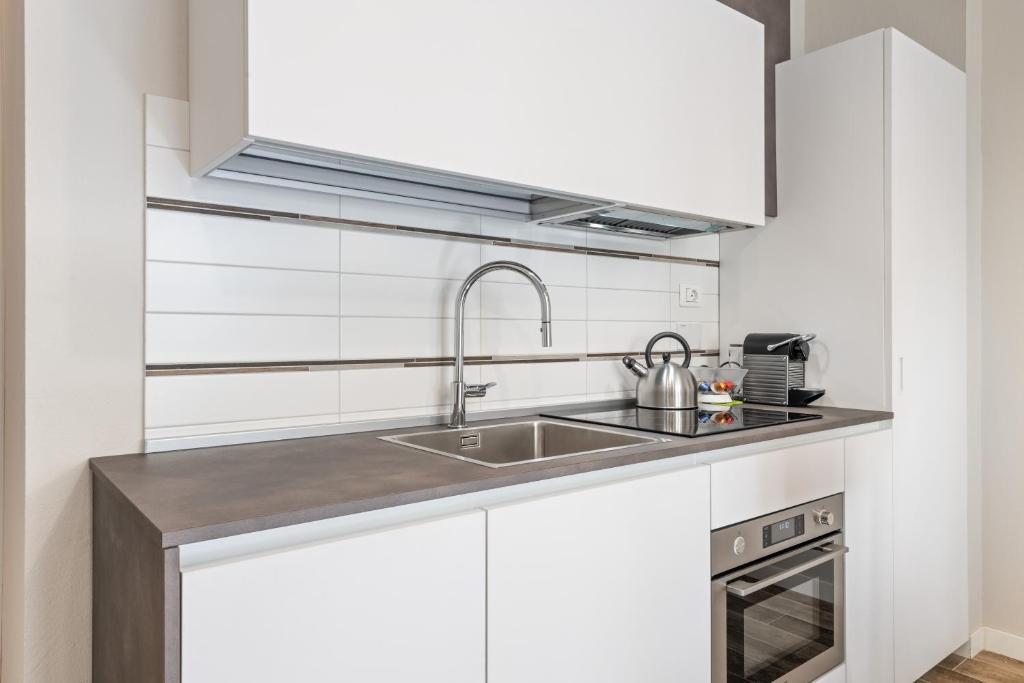 Kuchnia lub aneks kuchenny w obiekcie Maragliano Cozy Flat with Balcony
