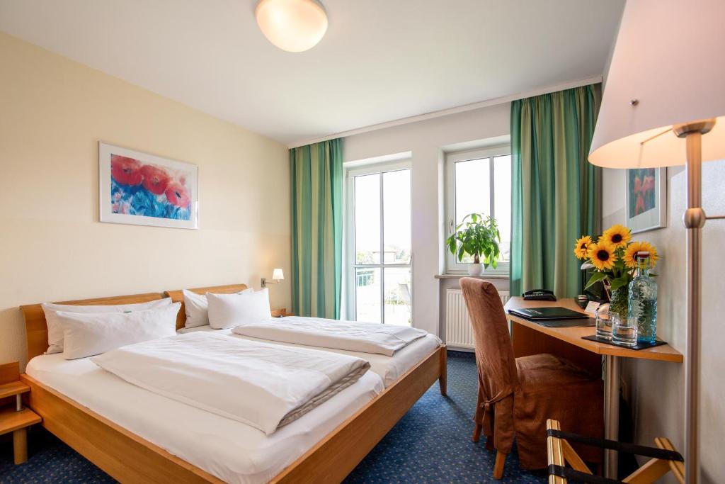 Postel nebo postele na pokoji v ubytování Arcus Hotel München Messe