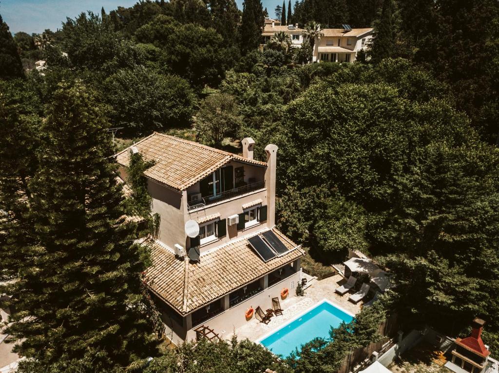 an aerial view of a house with a swimming pool at Villa Butterfly - Heated Private Pool & Jacuzzi in Corfu Town