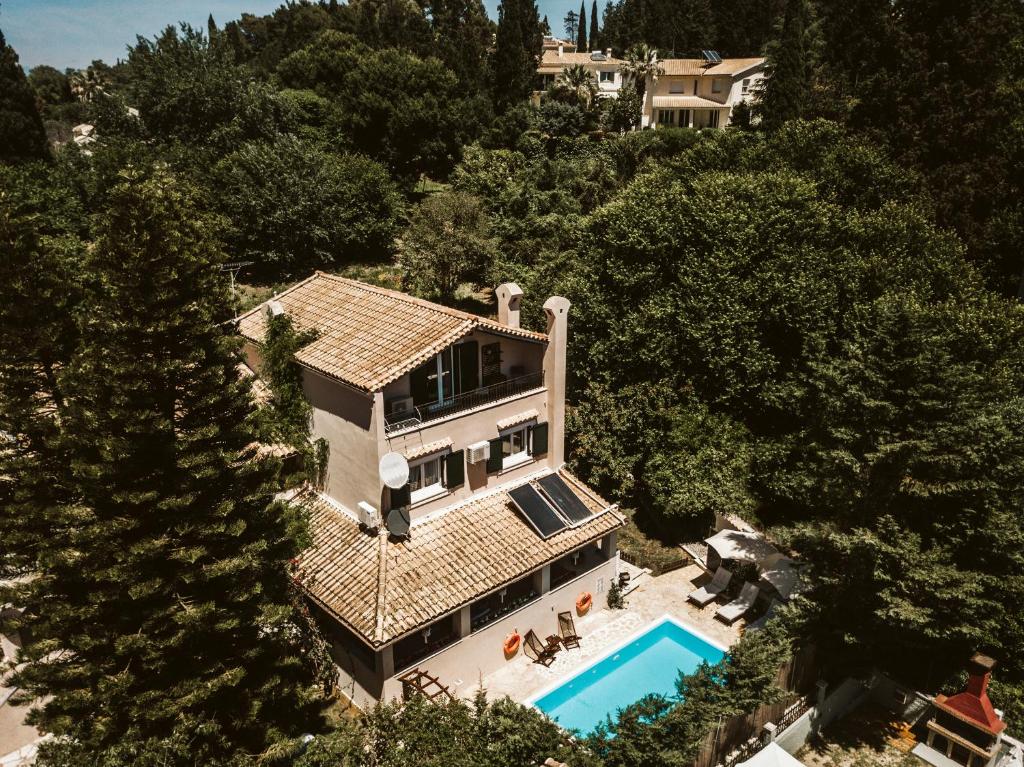 an aerial view of a house with a swimming pool at Villa Butterfly - Heated Pool, Jacuzzi, Sauna, Gym in Corfu Town