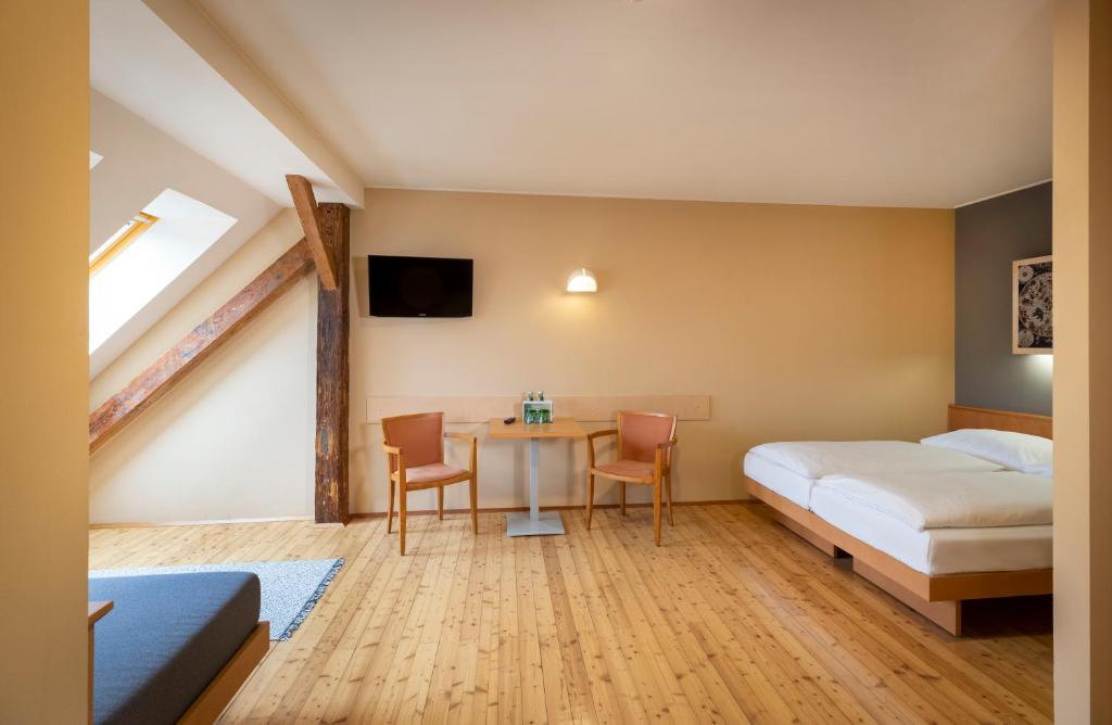 Postel nebo postele na pokoji v ubytování JUFA Hotel Judenburg - Self Check-In
