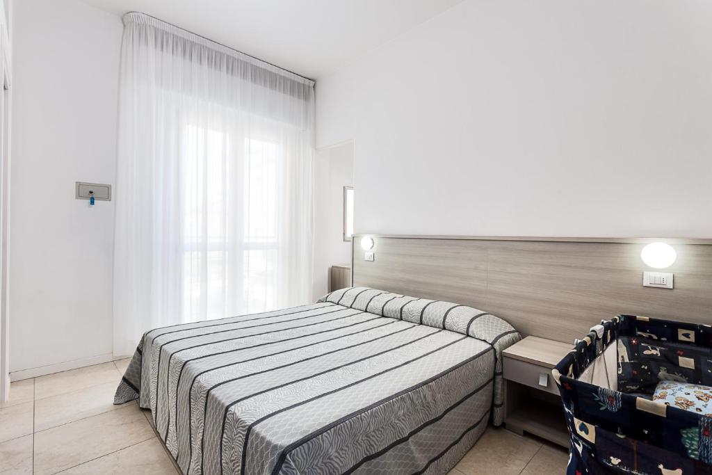 Postel nebo postele na pokoji v ubytování Hotel Blues