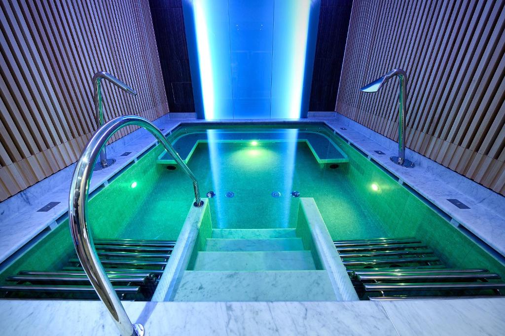 a pool of water with stairs in a building at Grand Hotel & Riviera in Lido di Camaiore