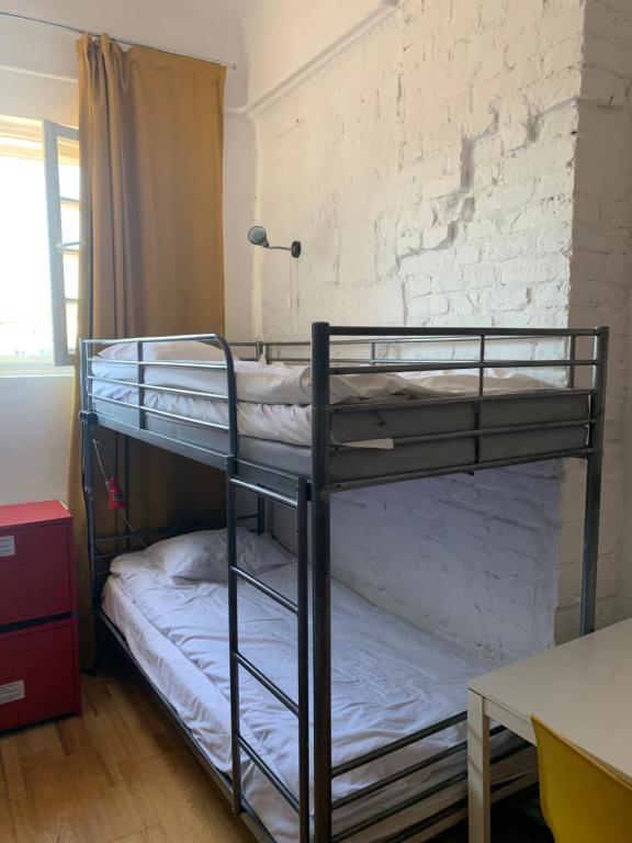 Posteľ alebo postele v izbe v ubytovaní New World St Hostel and Private Room
