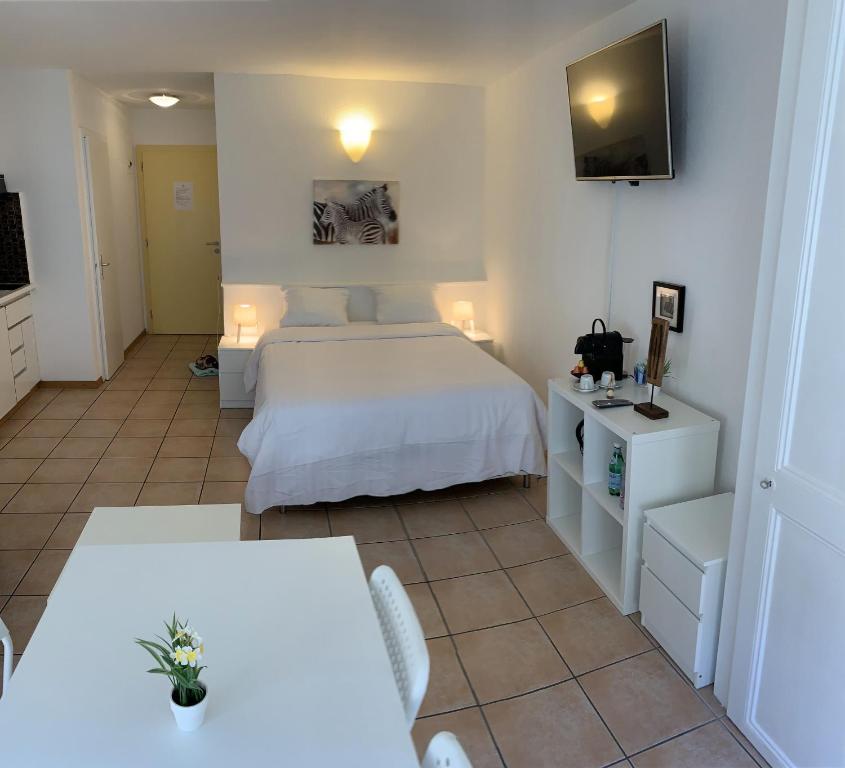 Postel nebo postele na pokoji v ubytování Residence Vue Chateau