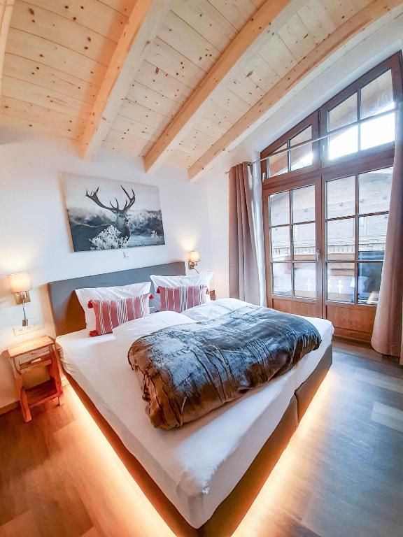 Posteľ alebo postele v izbe v ubytovaní Hochalmbahnen Chalets Rauris 1-10 WE2, Maislaufeldweg 1j OG