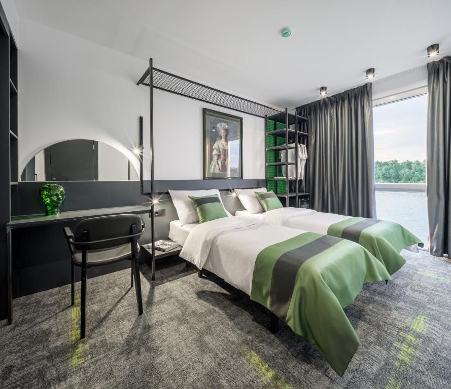 Postel nebo postele na pokoji v ubytování Joy 5 Hotel & SPA