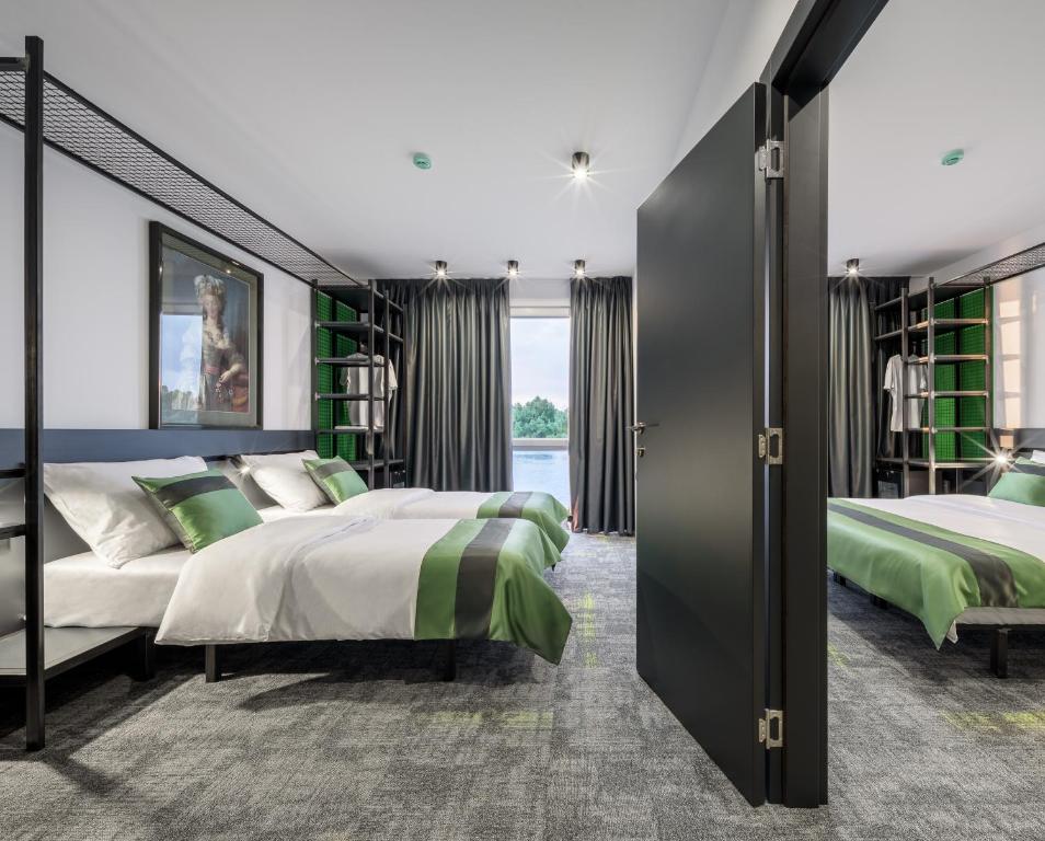 Postel nebo postele na pokoji v ubytování Joy 5 Hotel & SPA
