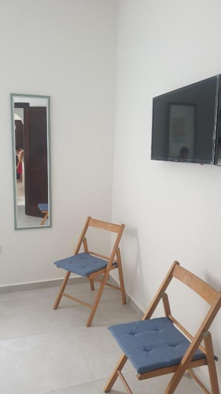 Televízia a/alebo spoločenská miestnosť v ubytovaní Casa Vacanze da Mary P