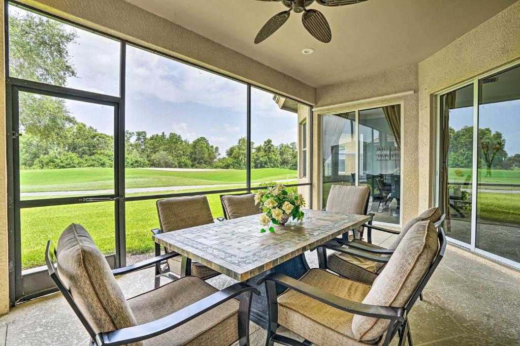 a dining room with a table and chairs at Luxurious Golf Course Getaway with Resort Perks in Naples