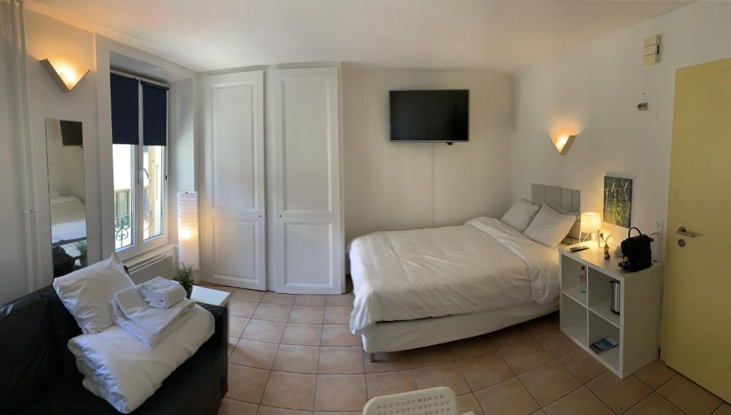Postel nebo postele na pokoji v ubytování Residence Vue Chateau