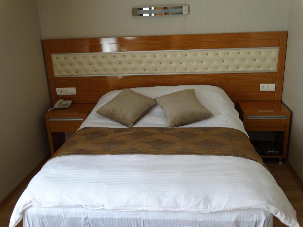Postel nebo postele na pokoji v ubytování Serenti Pamuk Hotel