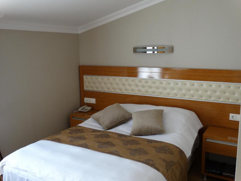 Postel nebo postele na pokoji v ubytování Serenti Pamuk Hotel