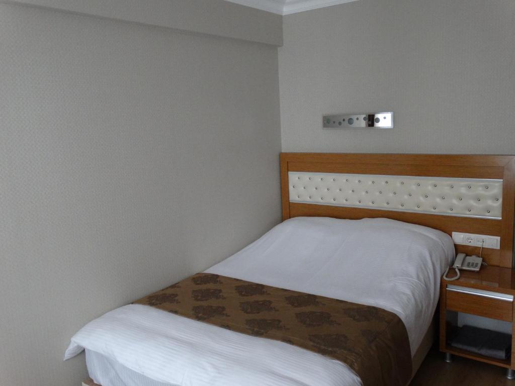Postel nebo postele na pokoji v ubytování Serenti Pamuk Hotel