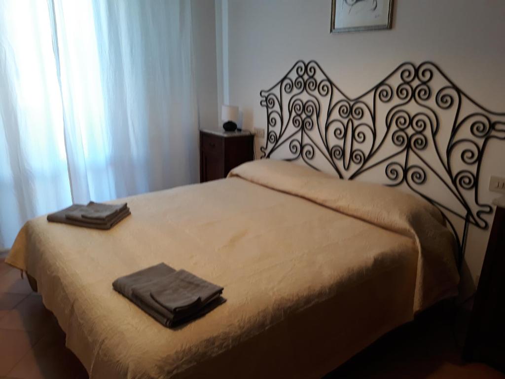 A bed or beds in a room at Casa Dori
