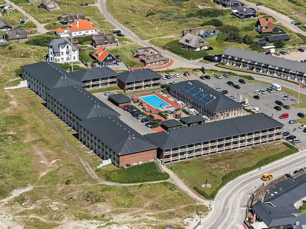 an aerial view of a building with a pool at 4 person holiday home on a holiday park in Fanø in Fanø