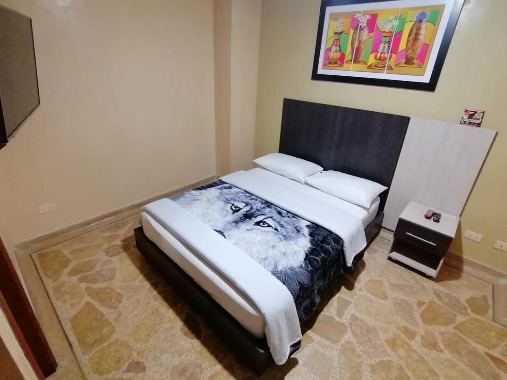 Postel nebo postele na pokoji v ubytování HOTEL GOLDEN SUITE