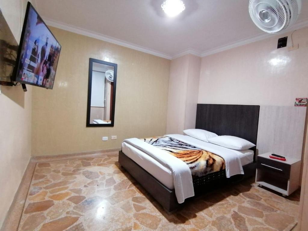 Postel nebo postele na pokoji v ubytování HOTEL GOLDEN SUITE